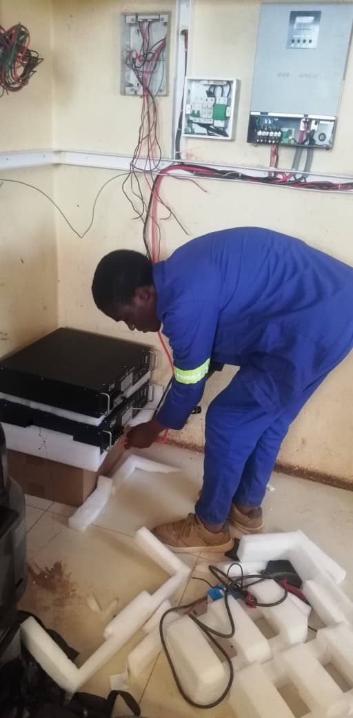 Technician working on electrical equipment